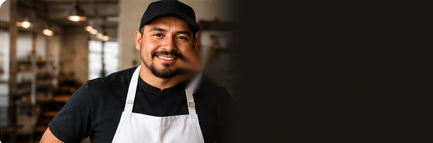 An illustrative small-business owner in a restaurant.